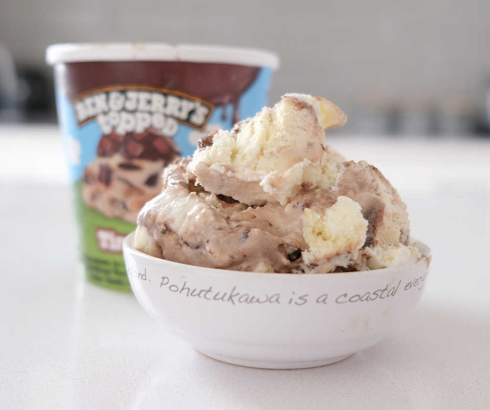 A bowl of Ben and Jerry's Topped Tiramisu with the packaging in the background.