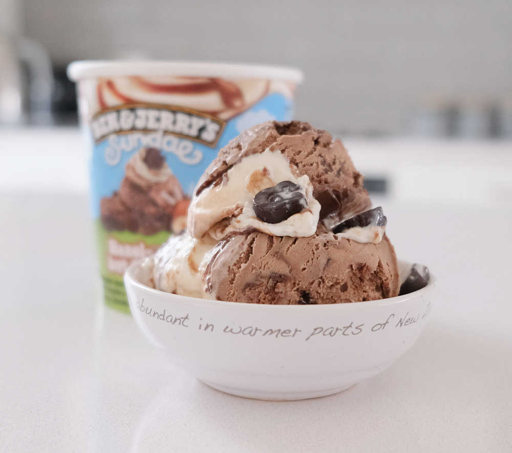 A bowl of Hazel-nuttin' but Chocolate Ice Cream with the packaging in the background.