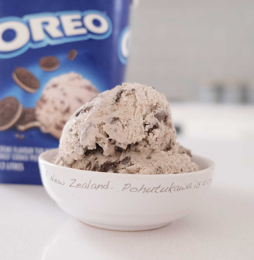 A bowl of Oreo frozen dessert with the packaging in the background.