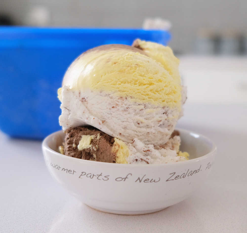 A large bowl of Peters Banana Split Frozen Confectionery with the packaging in the background.