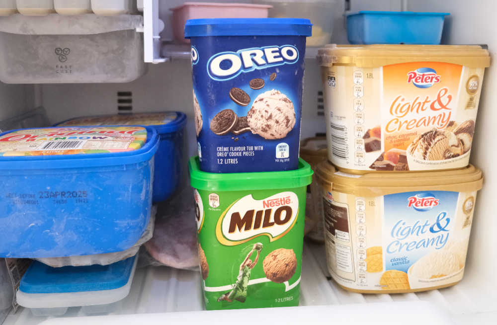 A home freezer full of ice cream brands including Milo 1.2L.