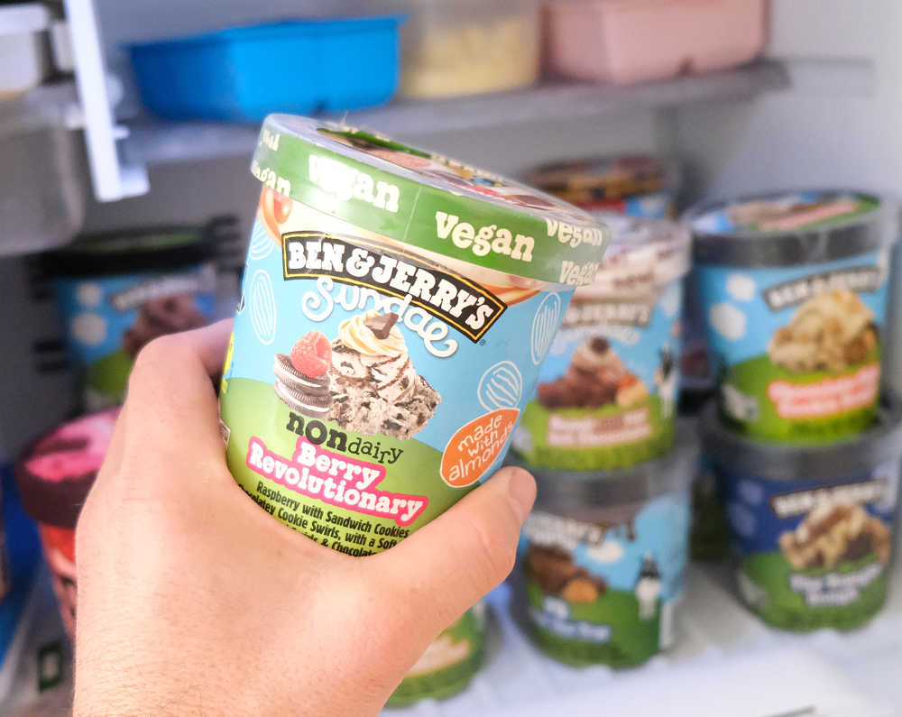 Holding a container of Ben & Jerry's Non Dairy Berry Revolutionary 427ml.