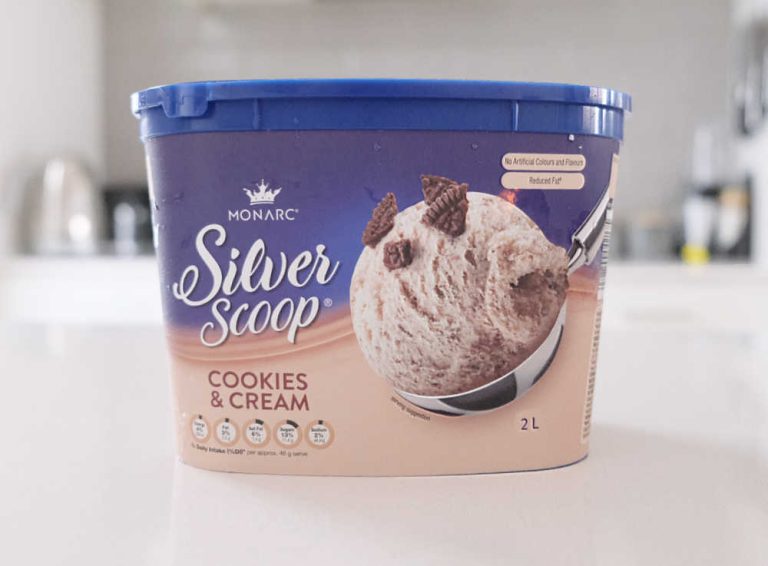 A container of Monarc Silver Scoop Cookies and Cream Ice Cream on a kitchen bench.