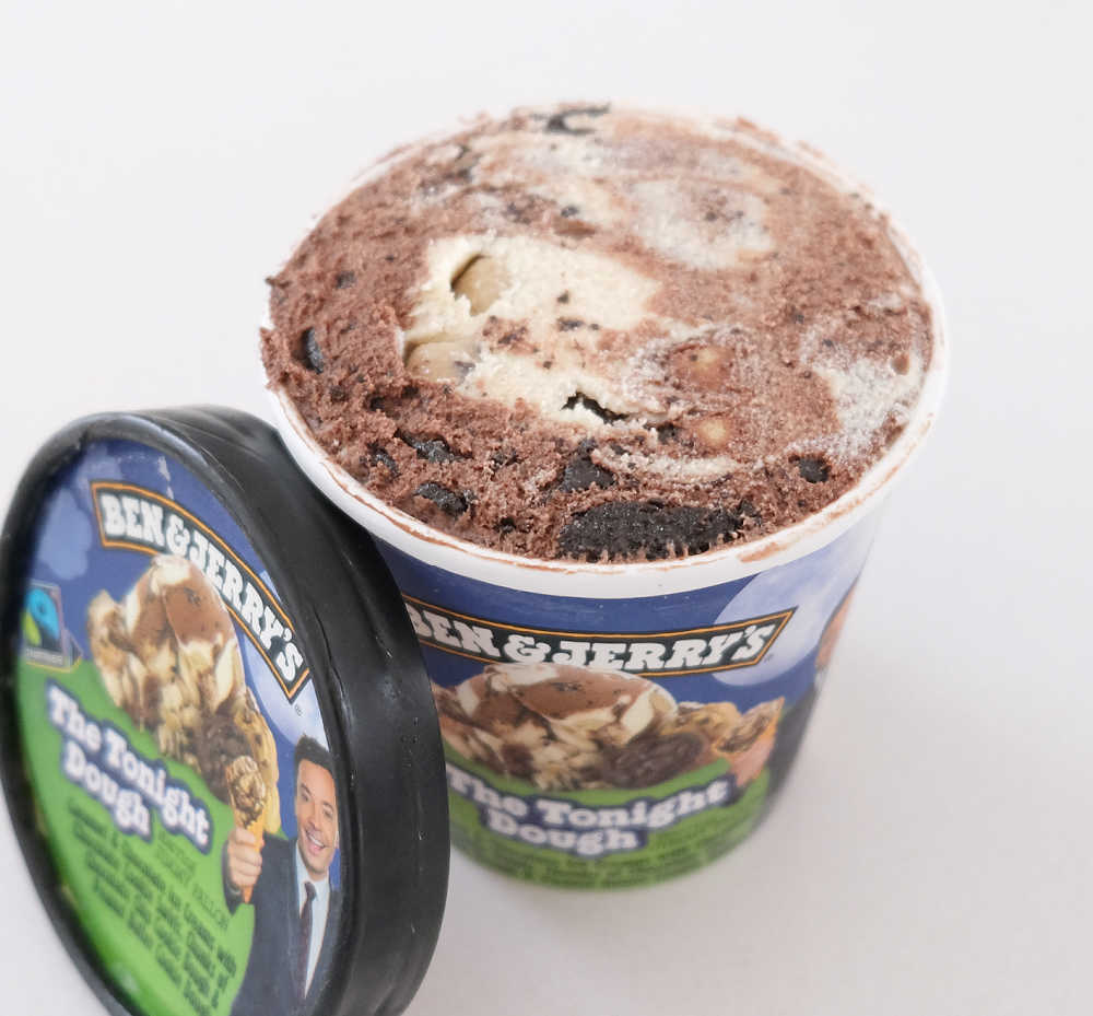 An open pack of Ben & Jerry's The Tonight Dough 458ml with the lid resting against the side.