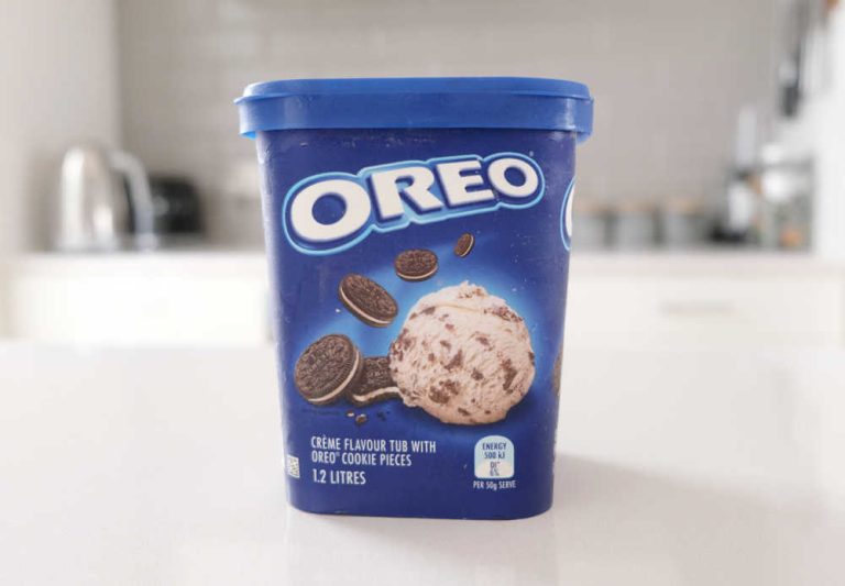 A tub of Oreo Ice Cream 1.2L on the kitchen bench.