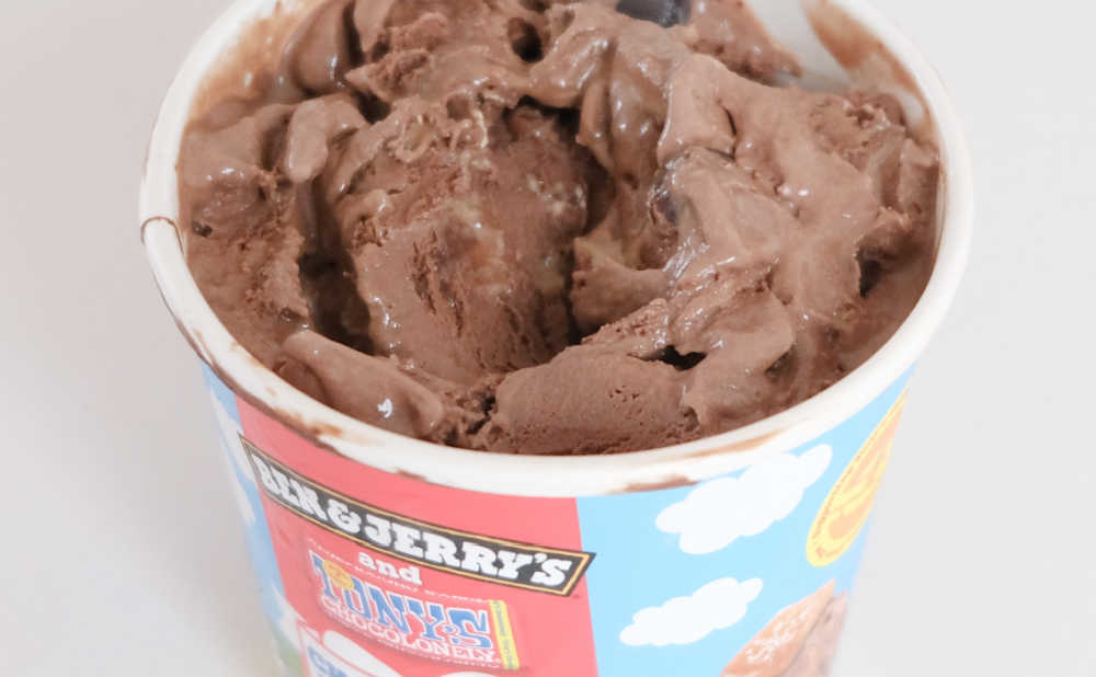 Partly eaten tub of Ben & Jerry's Chocolatey Love A-Fair ice cream.