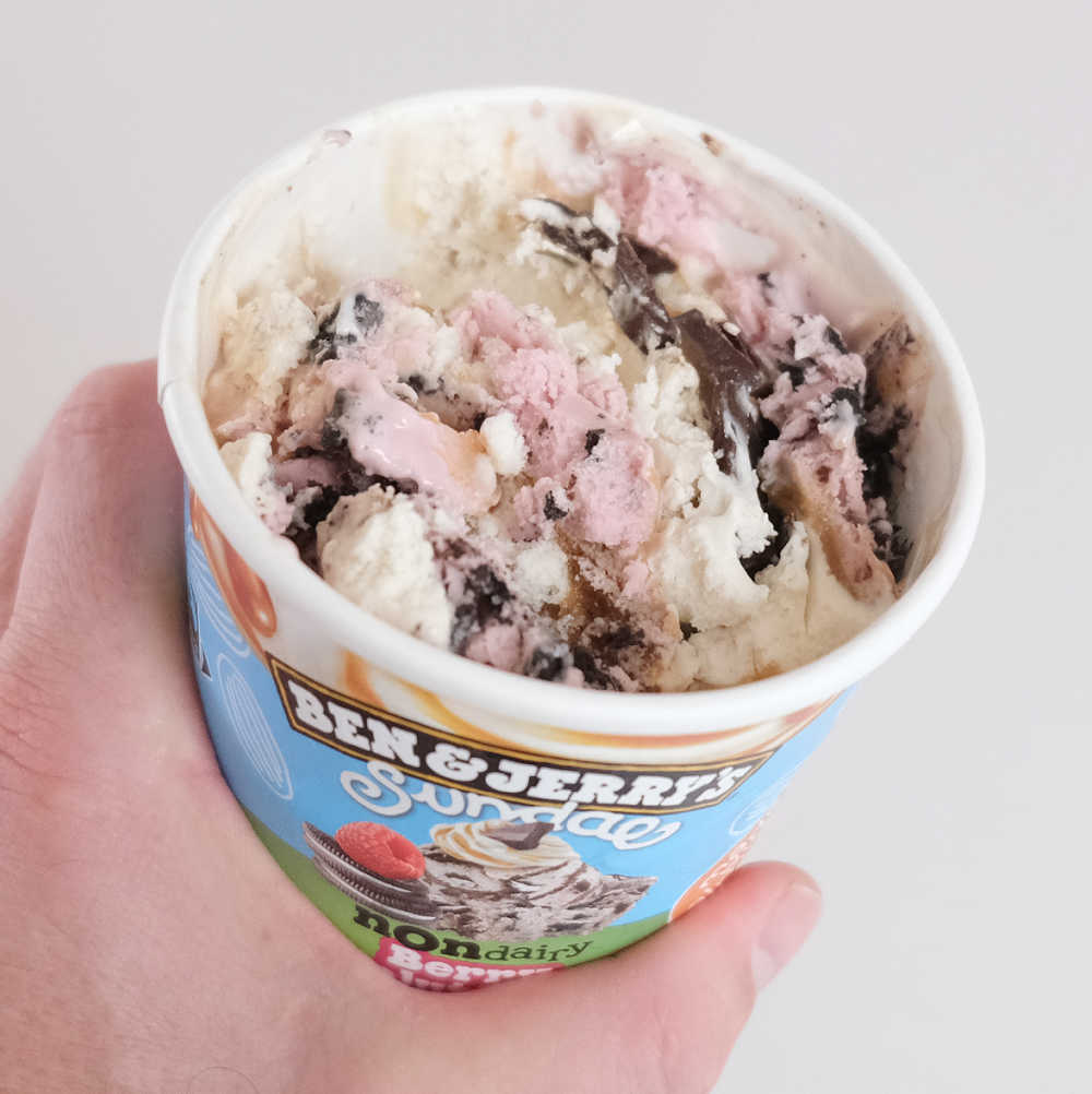 A partly eaten container of Sundae Non Dairy Berry Revolutionary.