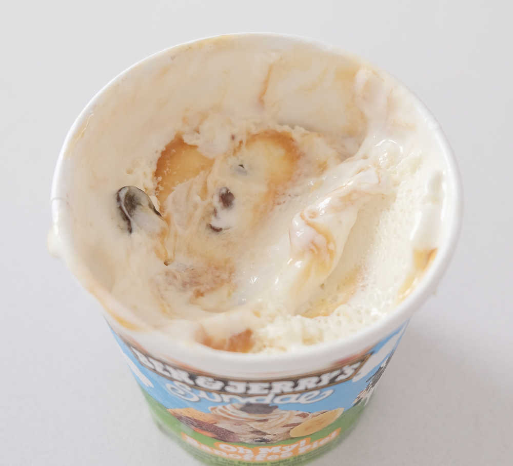A partly eaten container of B and J Banoffee Ice Cream.