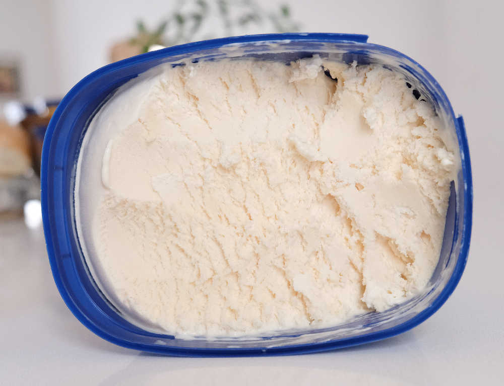 A Partly eaten pack of Monarc Silver Scoop Vanilla 2L.