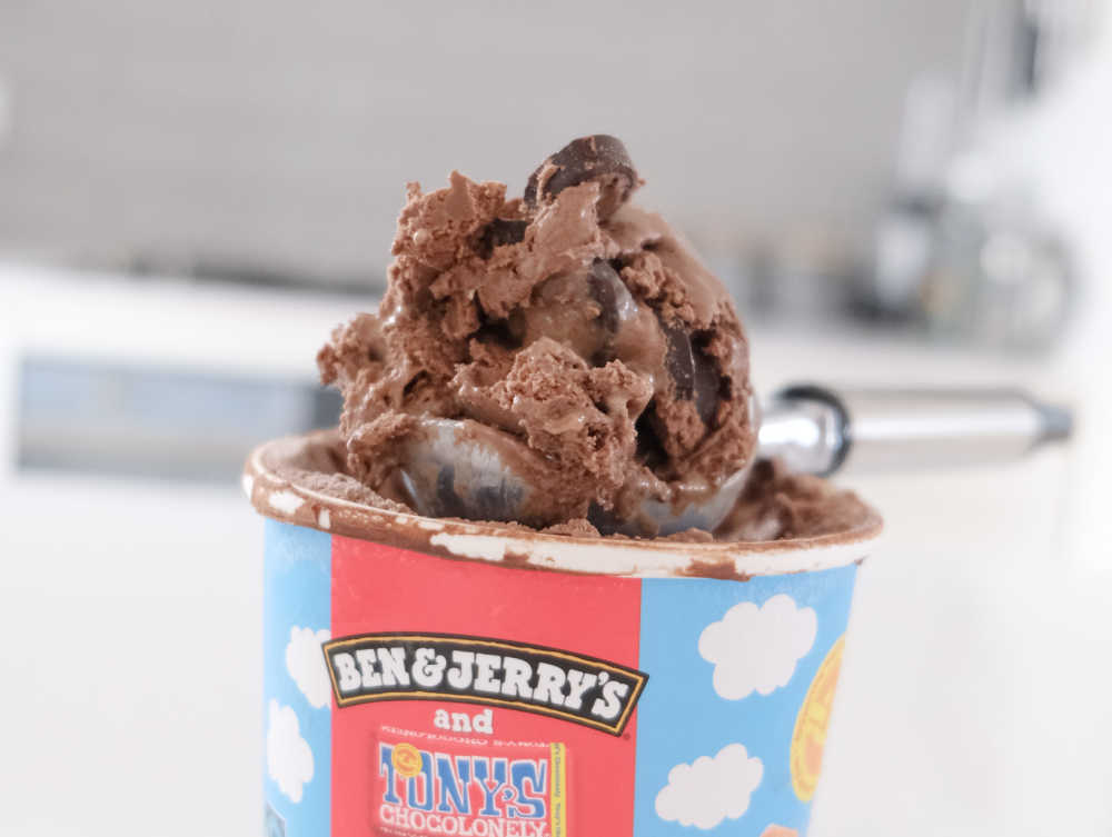 A scoop of Chocolatey Love A-Fair sitting on top of the container.