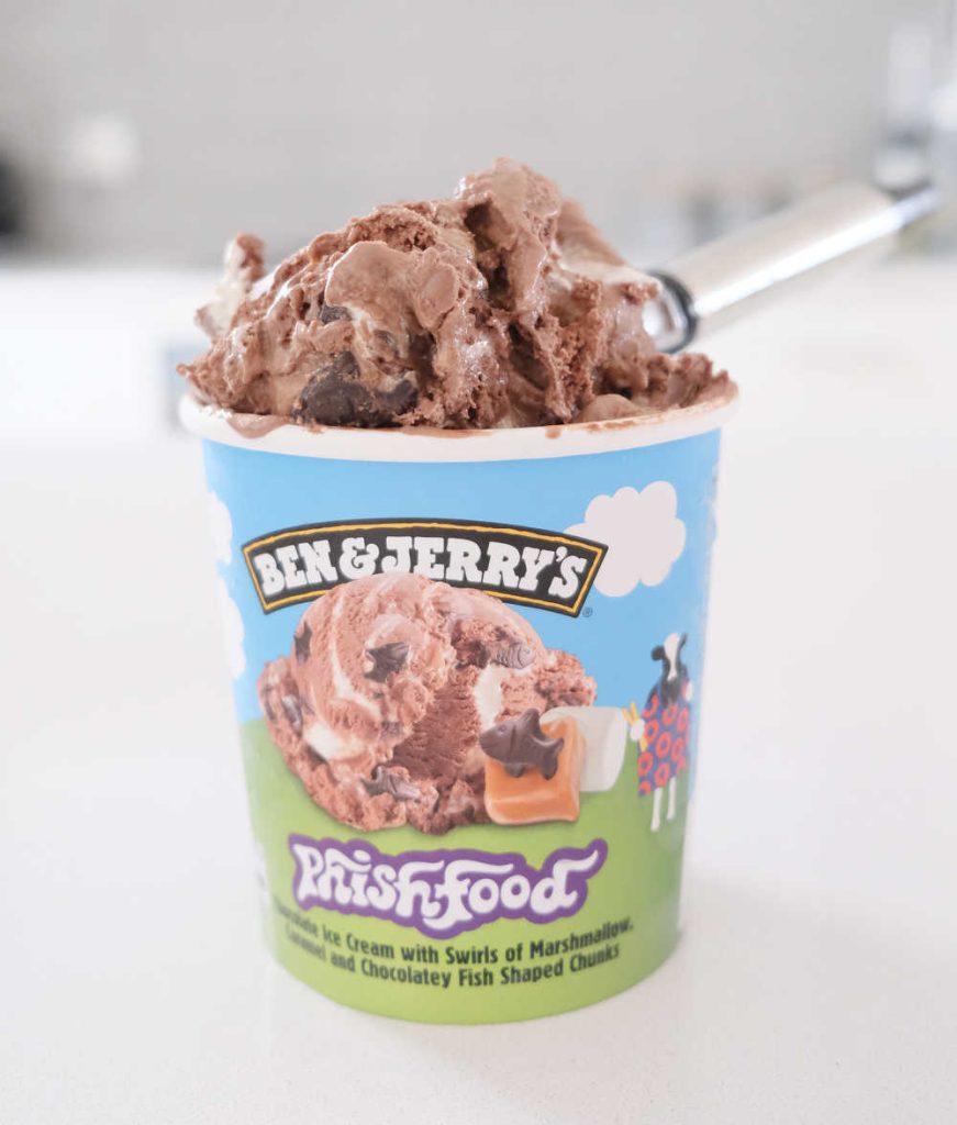 A vertical photo of the Phish Food packaging and a scoop full of ice cream.