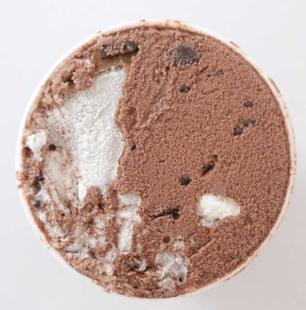Top down view of an unscooped tub of Phish Food.