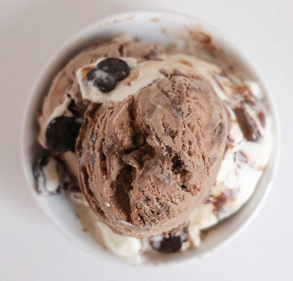 A top down photo of a bowl of Ben & Jerry's Hazel-nuttin' but Chocolate Ice Cream.