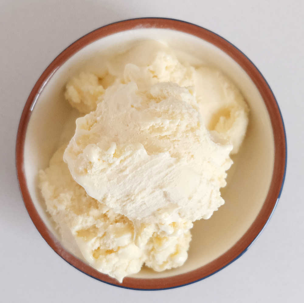 Bird's eye shot of a bowl of reduced fat vanilla ice cream.