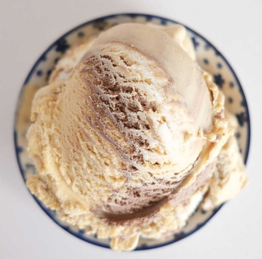 Top down bowl of Peters Light and Creamy Choc, Caramel and Vanilla Swirl.