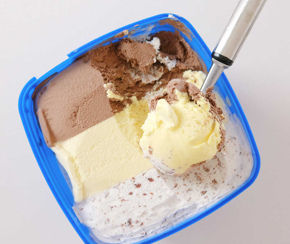 Top down image of Peters Banana Split with the scoop resting on the top.