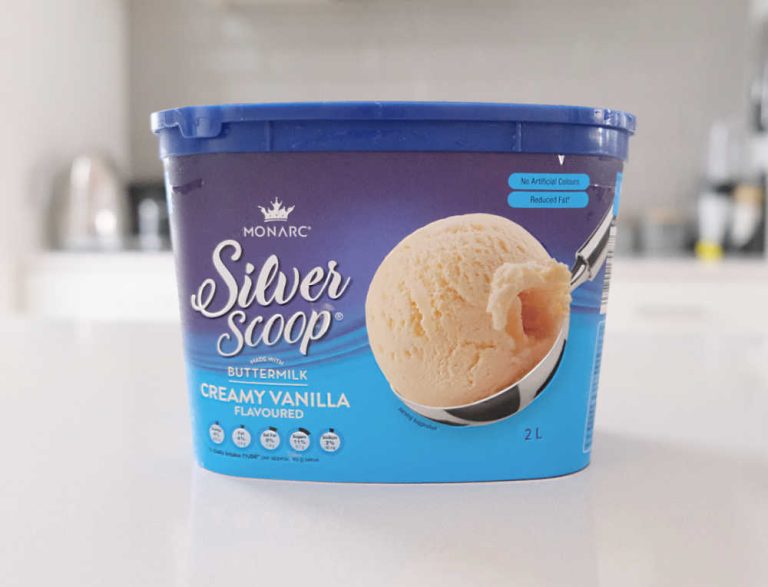 A container of Monarc Silver Scoop Vanilla Ice Cream 2L on a kitchen bench.