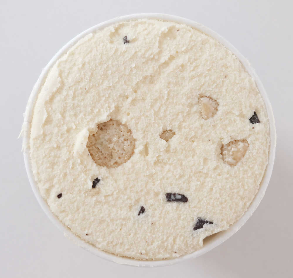 Bird's eye photo of an opened pint of Ben and Jerry's Choc Chip Cookie Dough Ice Cream.