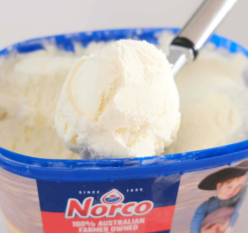 Closeup of a scoop of Norco Classic Vanilla frozen dessert.