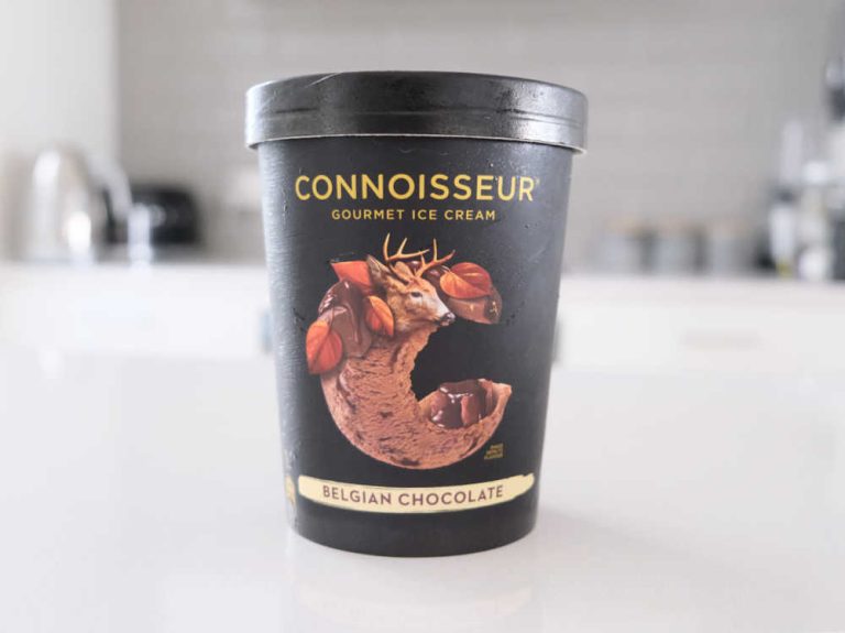 A tub of Connoisseur Gourmet Ice Cream Belgian Chocolate 1L on a kitchen bench.
