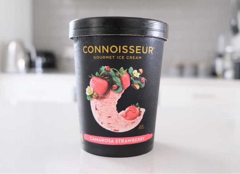 Tub of Connoisseur Gourmet Ice Cream Camarosa Strawberry 1L on a kitchen bench.