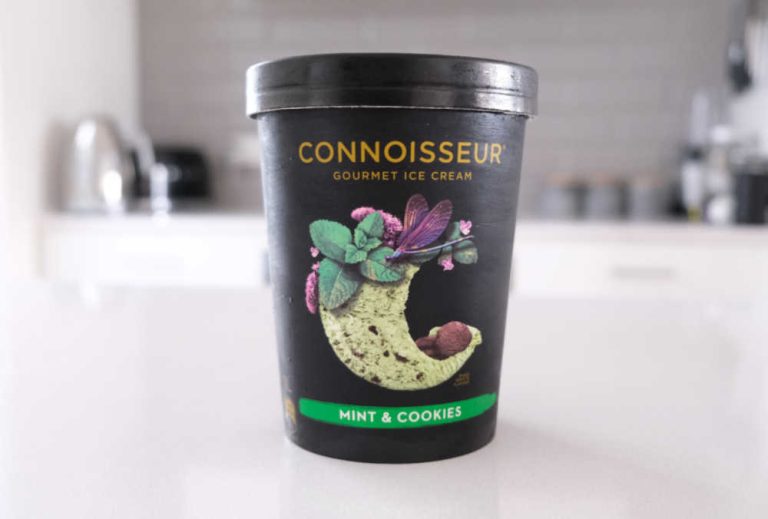A tub of Connoisseur Gourmet Ice Cream Mint & Cookies 1L on a kitchen bench.