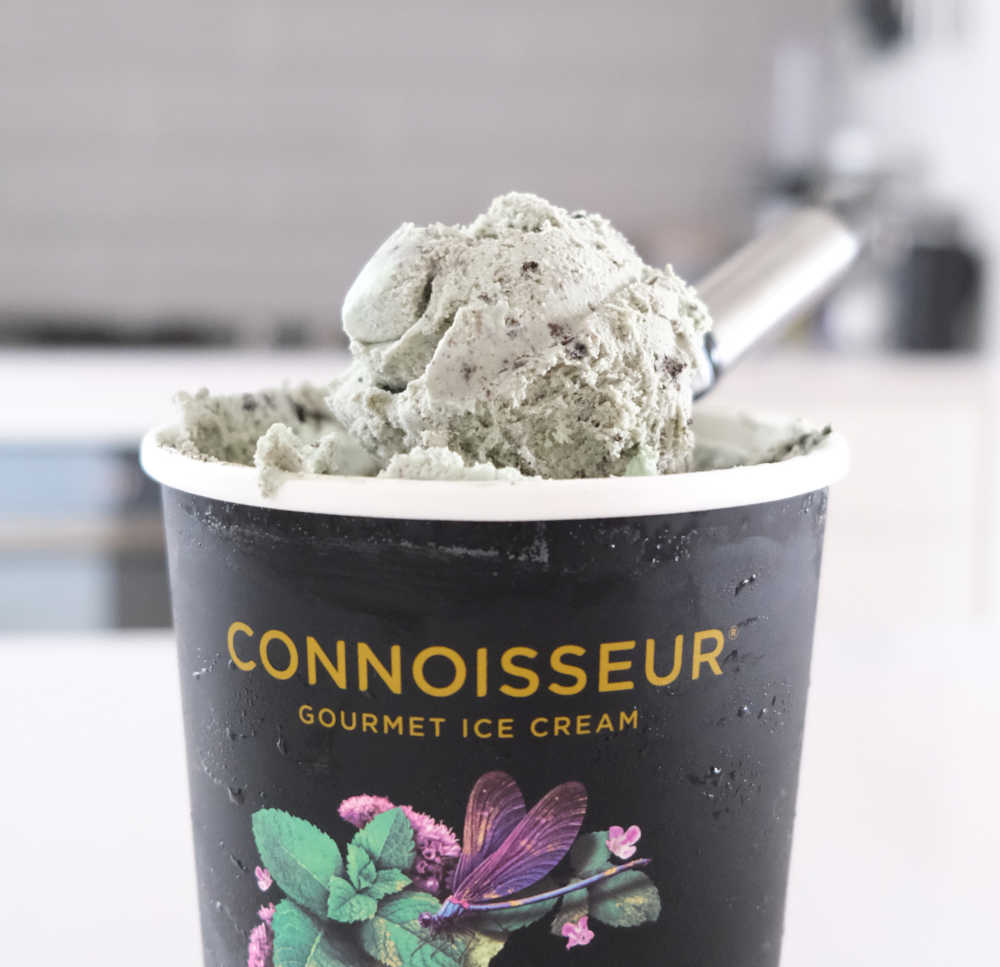A shot of the Connoisseur Mint Cookies packaging with some ice cream scooped on the top of the pack.