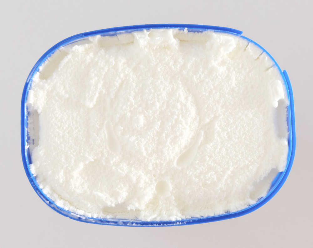 An unscooped pack of Norco Classic Vanilla Ice Cream.