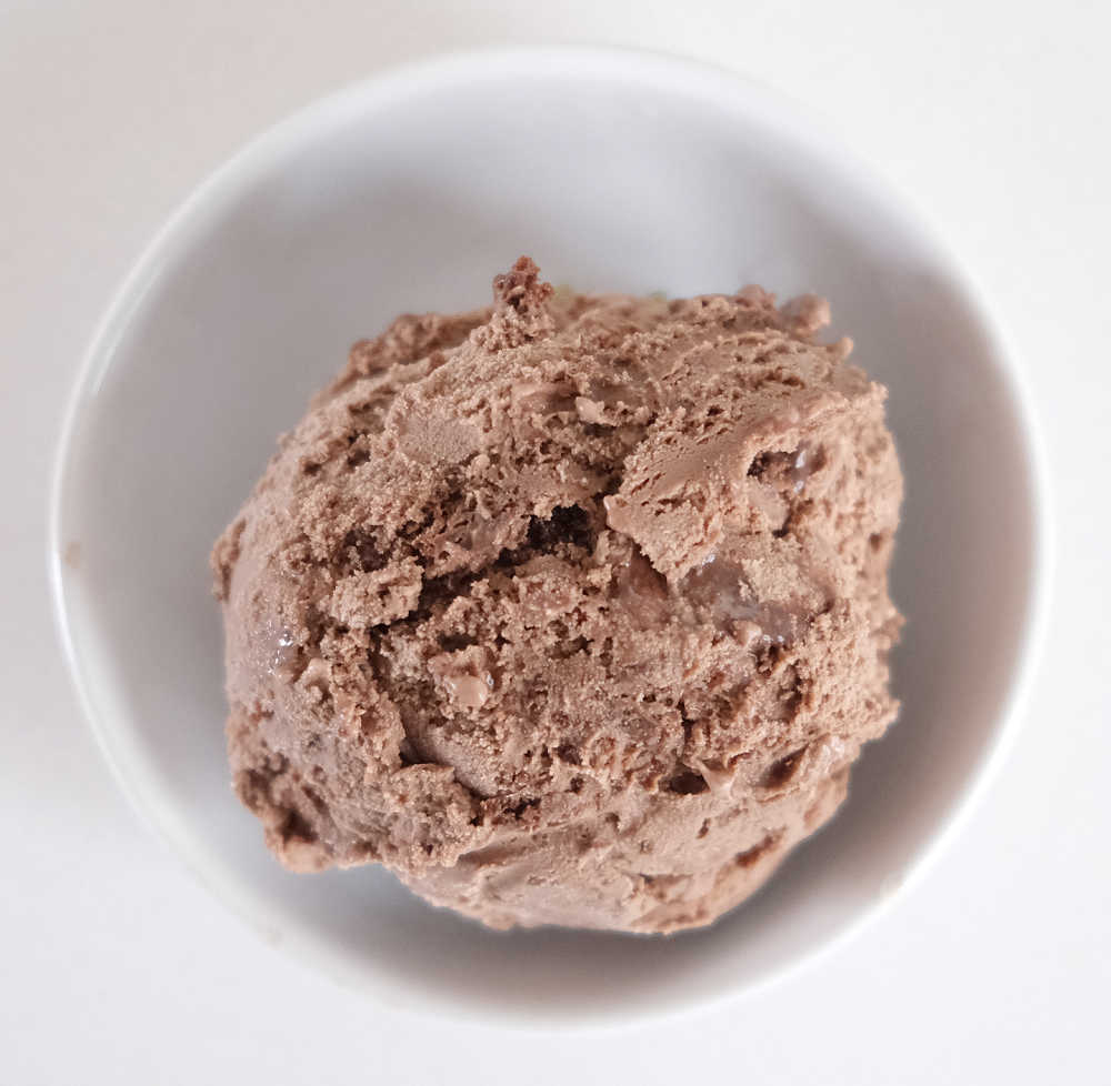 Top down image of a bowl of Chocolate Brownie Custard Ice Cream.