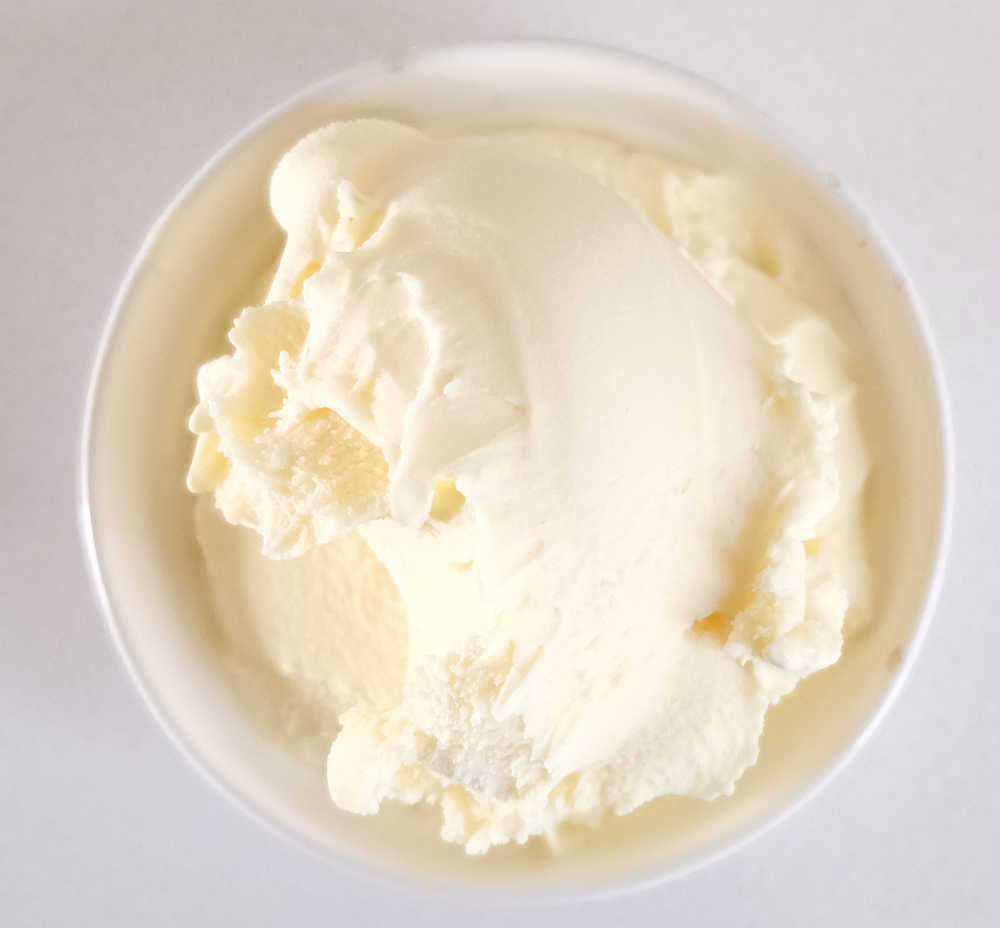 Top down shot of a bowl of Connoisseur Ice Cream Classic Vanilla.