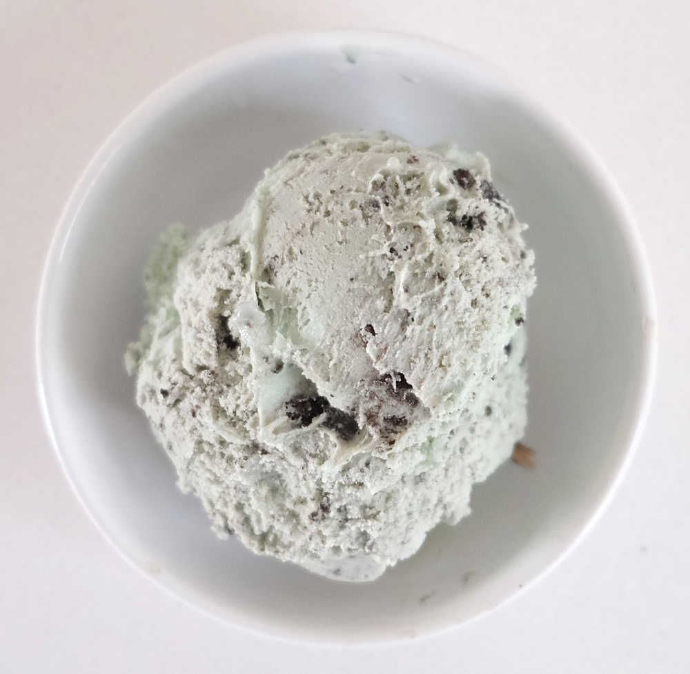 Top down image of a scoop of Connoisseur Gourmet Ice Cream Mint and Cookies in a bowl.
