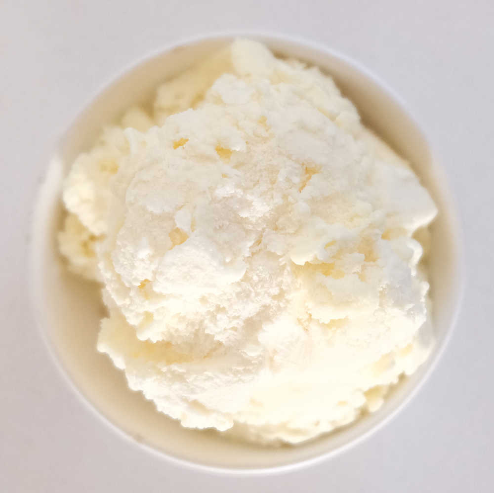 Top down photo of a bowl of Peters Vanilla No Sugar Added Ice Cream.