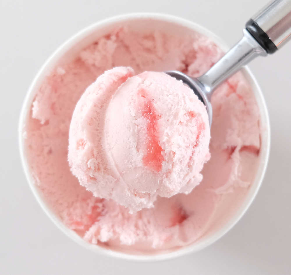 Bird's eye picture of a scoop of Connoisseur Gourmet Ice Cream Camarosa Strawberry.