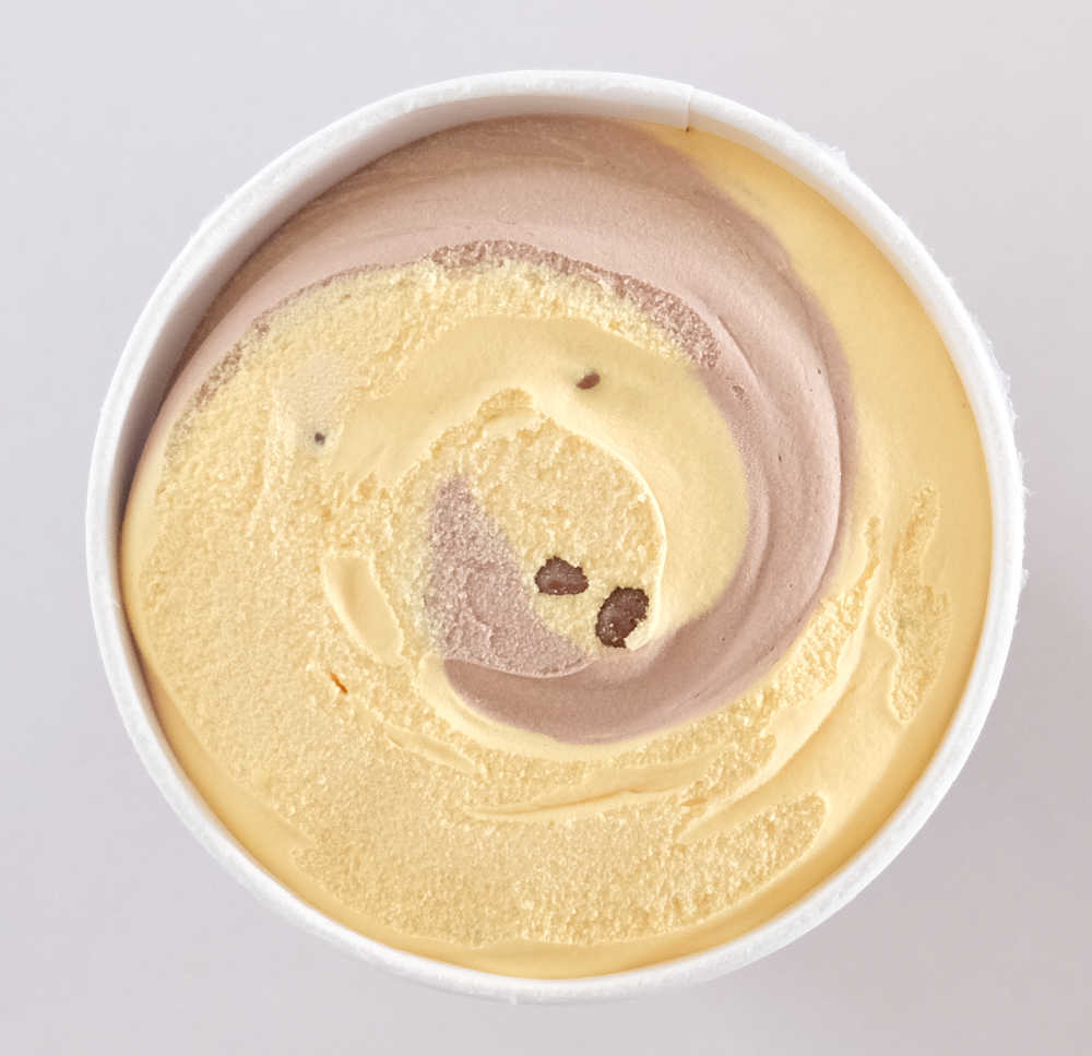 An unscooped tub of Violet Crumble Choc Honeycomb Ice Cream 1L.