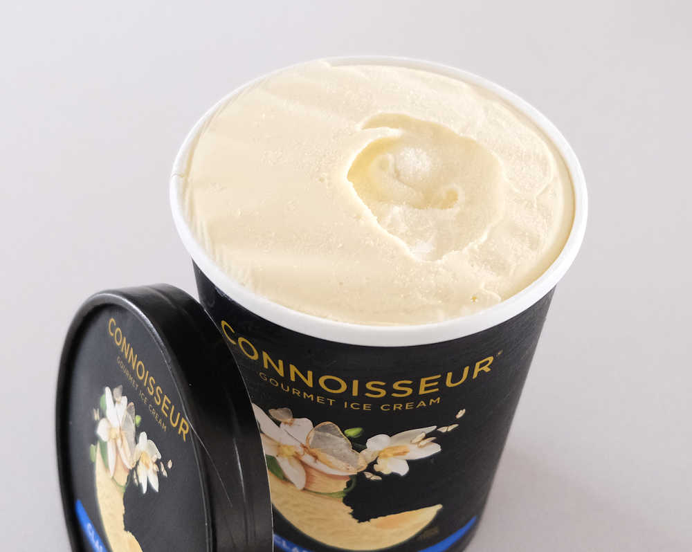 An unscooped tub of Classic Vanilla by Connoisseur.